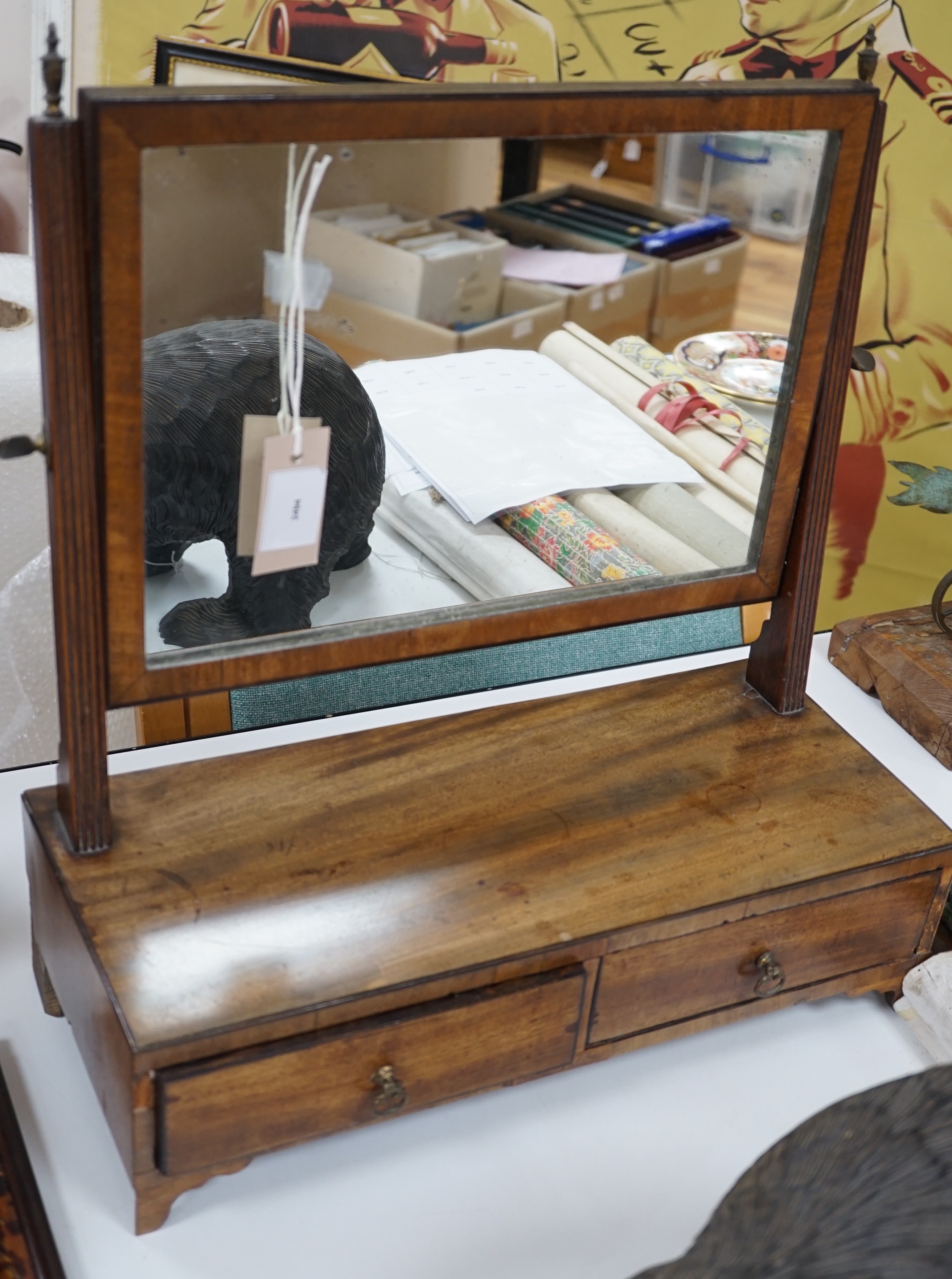 A 19th century mahogany toilet mirror, 49 cms high